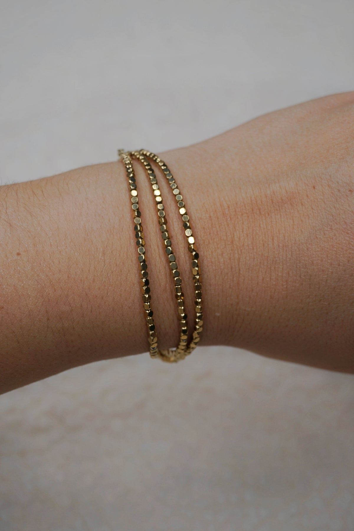 Bracelet doré triple brillant