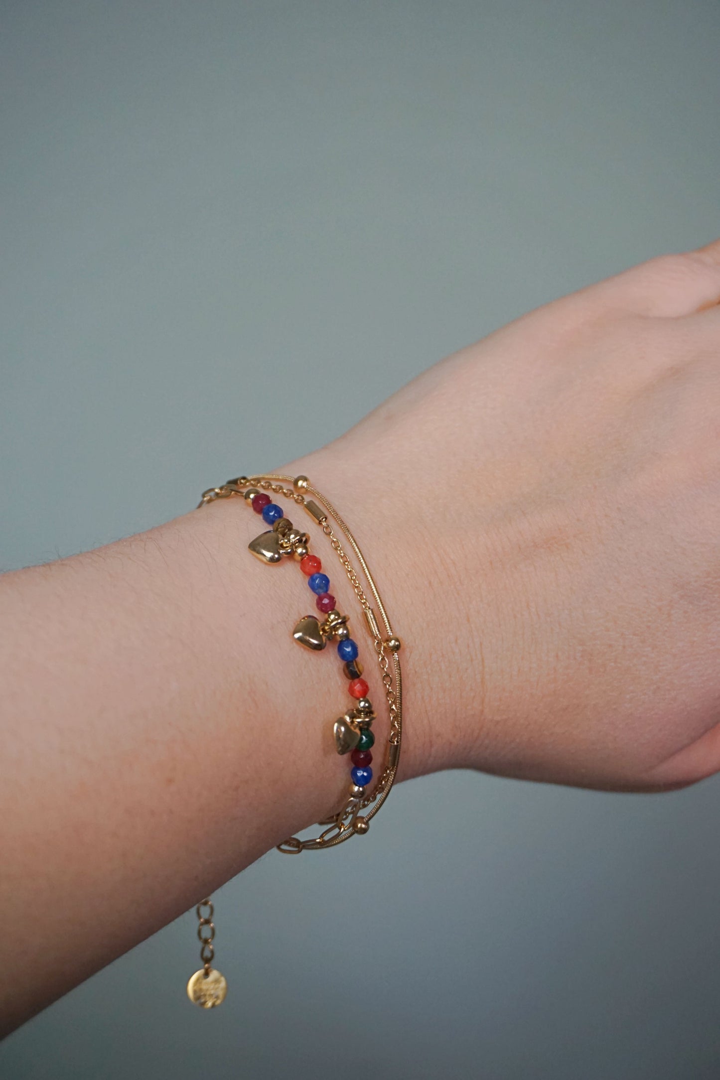 Bracelet doré triple coloré cœurs
