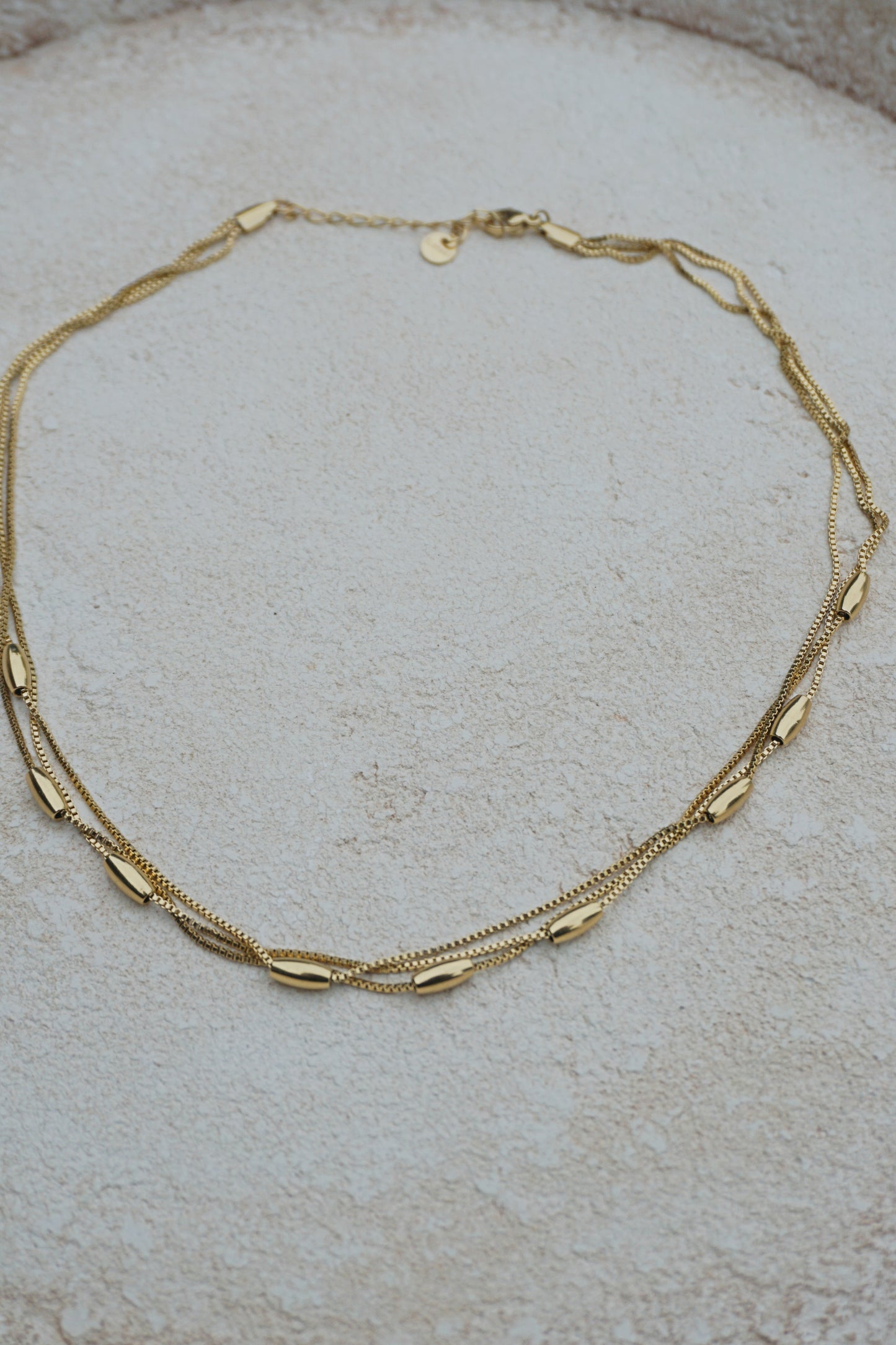 Collier doré boules ovales