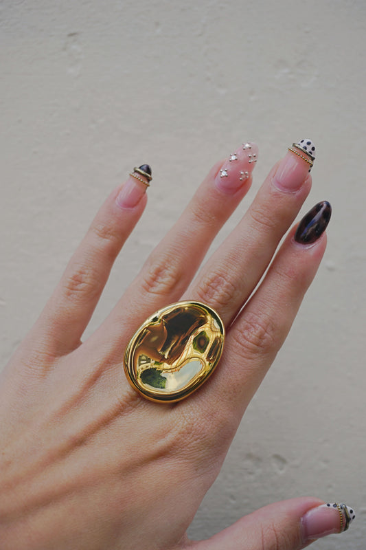 Bague dorée design galet