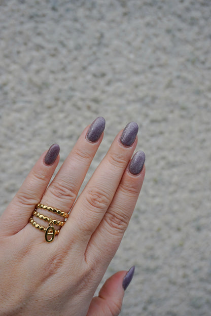 Bague dorée triple et breloque