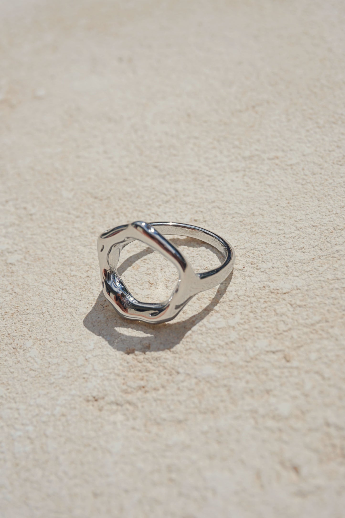 Silver asymmetrical round ring