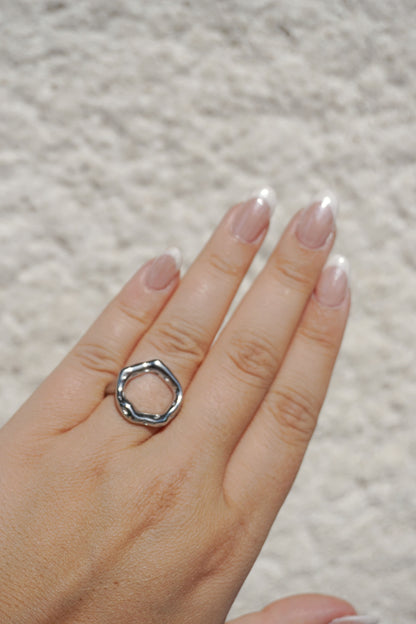 Silver asymmetrical round ring