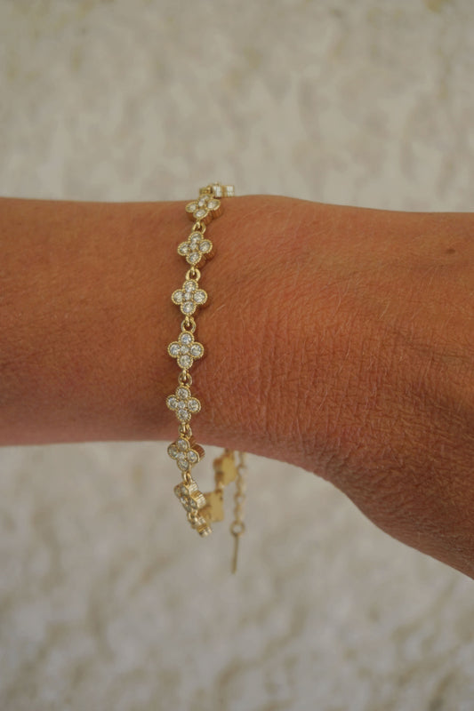 Bracelet doré et trèfles strass
