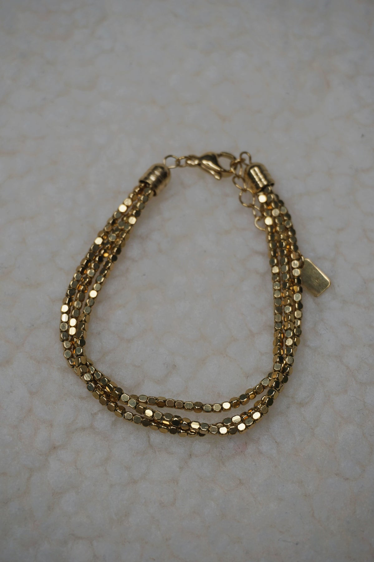 Bracelet doré triple brillant