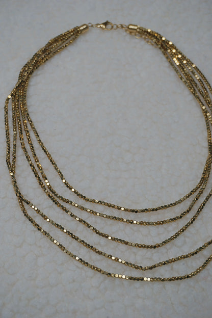 Collier doré brillant cinq rangs