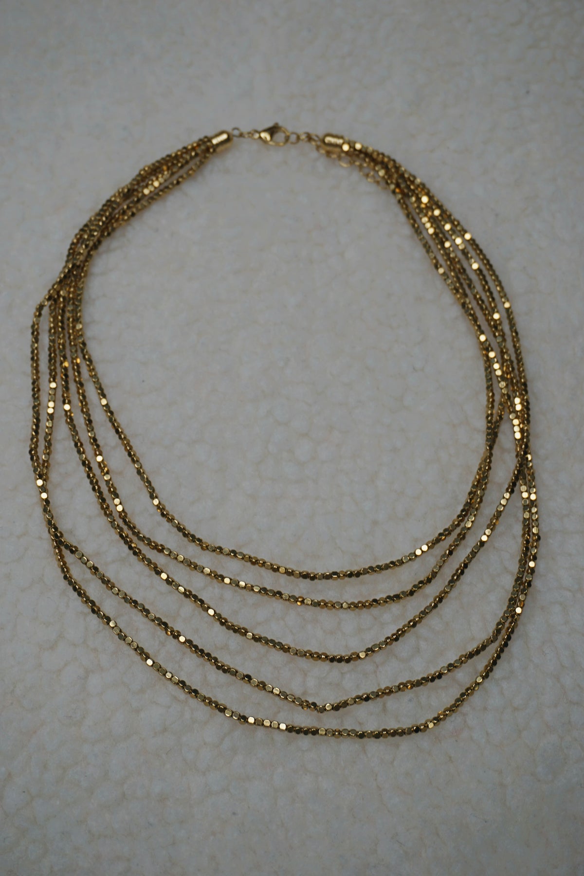 Collier doré brillant cinq rangs