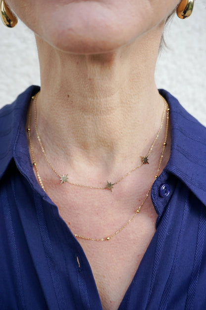 Collier doré double chaîne étoiles