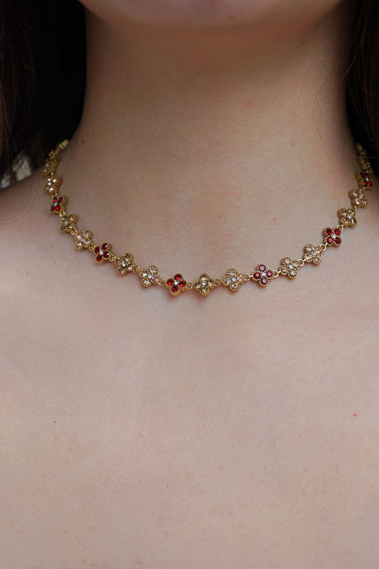 Collier doré et trèfles champagne