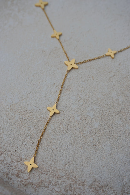 Collier doré tombant étoiles