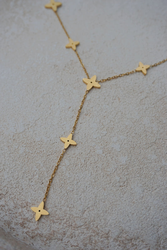 Collier doré tombant étoiles