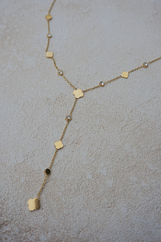 Collier doré tombant trèfles et strass