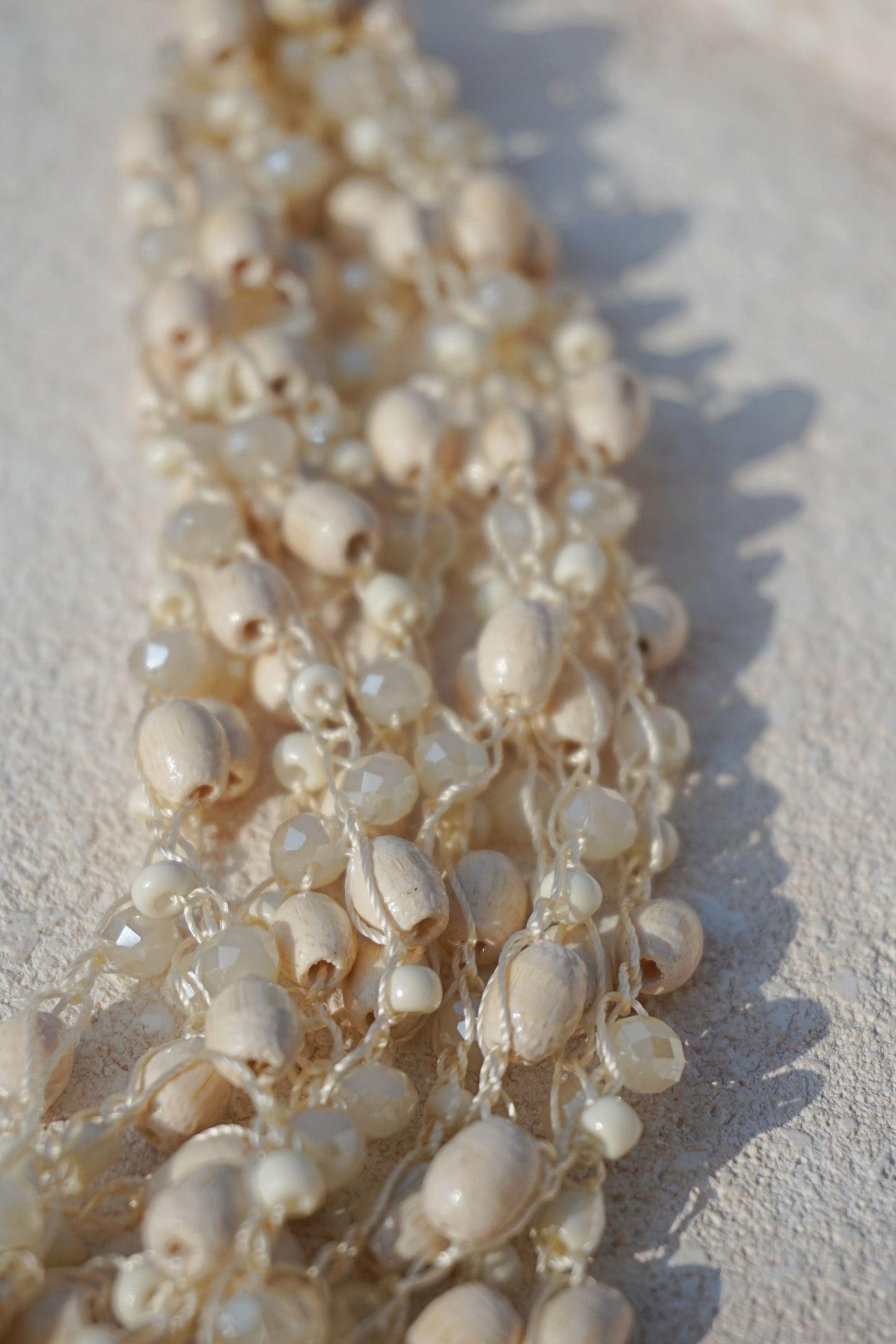 Gros collier perles crèmes multi rangs