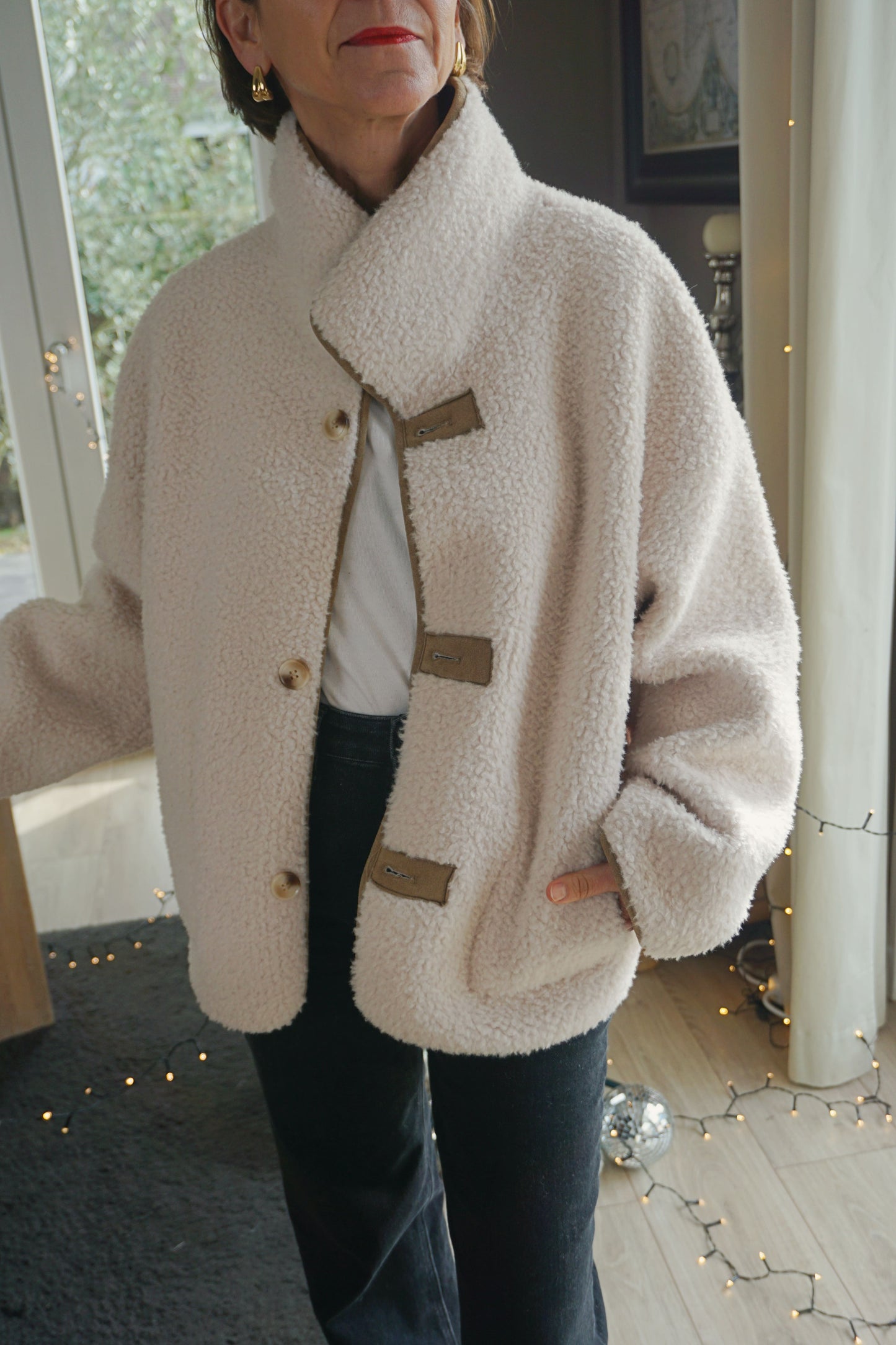 Manteau réversible effet daim et teddy