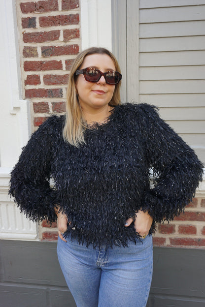 Top noir effet plumes et paillettes