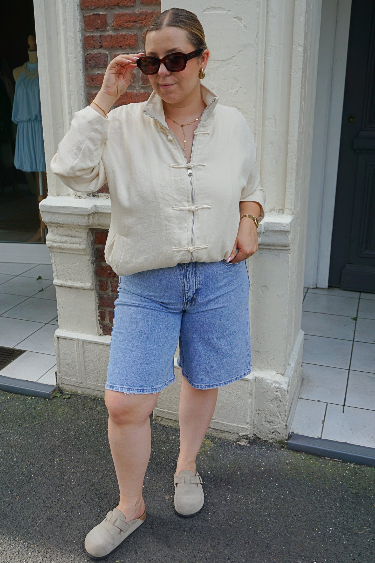 Veste crème à fermoirs tissus